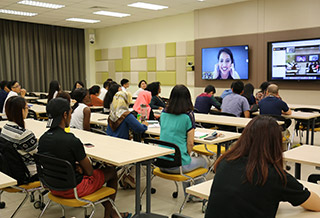 Students attending lecture in a one of the campus' distributed learning rooms.