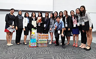 The Champion team from TAR UC after receiving the hamper, plaque and certificates from Ms Hasimah Hafiz Ahmad (second from left), President of MIFT and Ms Amie Wo (leftmost), Vice President of MIFT.