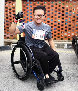 Daniel Lee proudly showing off his TARCian Run 2019 medal after the race.