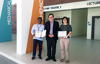 Jaison (left) displaying his awards with Dean of Faculty of Engineering and Science Prof Lau Hieng Ho and Dr Stephanie Chan