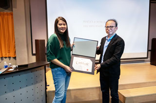 Hex is presented with a token of appreciation by Mr. Chan Kon Loong, Deputy Course Director of Advertising & Graphic Design.