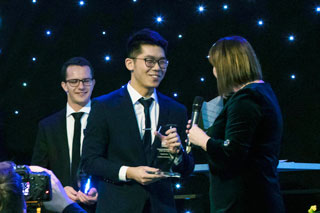Carlos Wong (centre) receiving his award from Susan Pitter (rightmost), EY Young Tax Professional of the Year sponsor and EY Deputy Global Vice Chair – Tax.